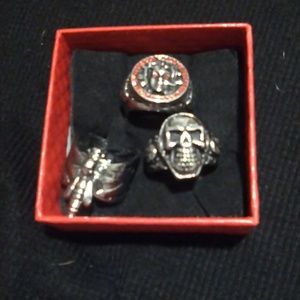 Three stainless steel skull rings size 10 one with red rubie zirconius excellent